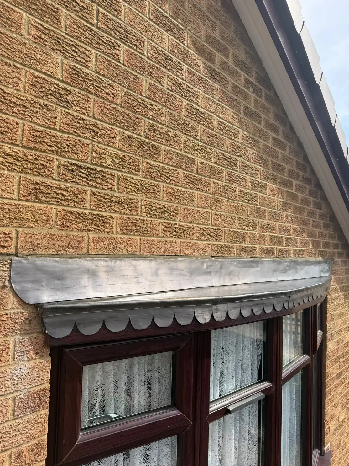 The rebuilt bay window canopy finished with a new lead covering