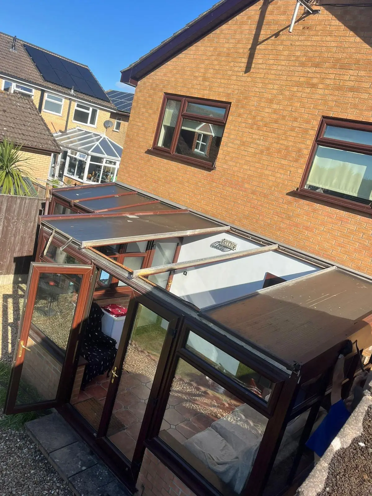 A conservatory with its original glass roof before replacement