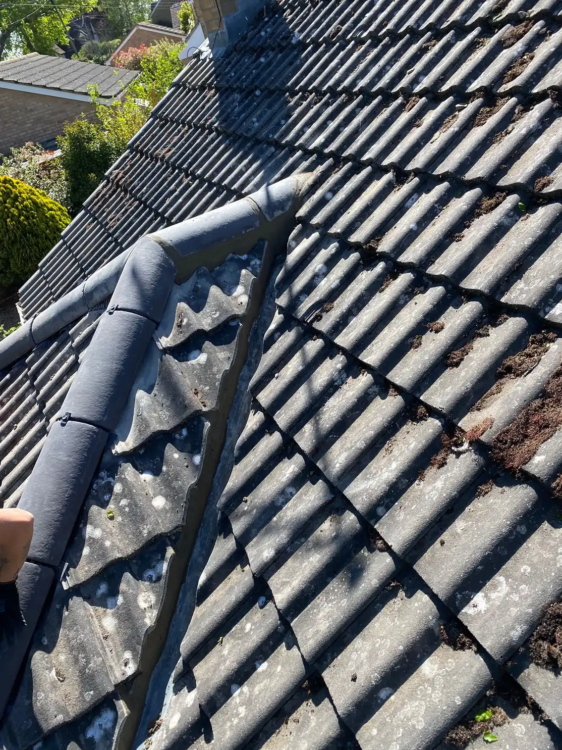 Counter battens fixed across a roof alongside the chimney stack during a re-roof