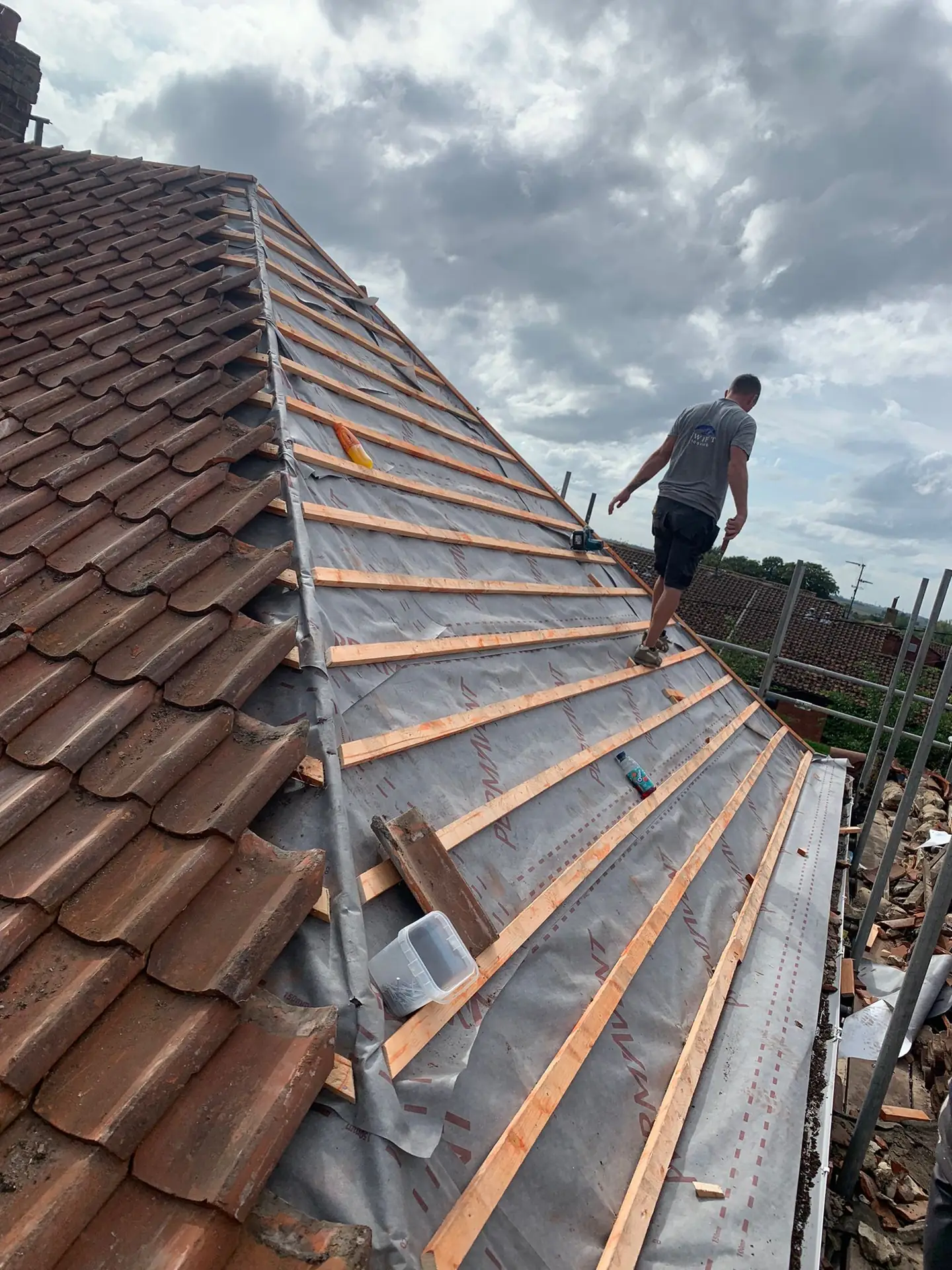 A roof replacement under way on a PE14 property with scaffold up and the old pantiles stripped back