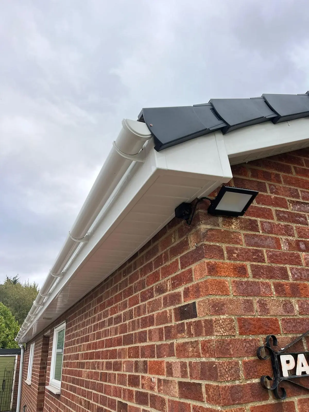 New white uPVC fascia, soffit and guttering fitted to a brick bungalow